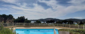 Bright cocoon with pool - facing the sea